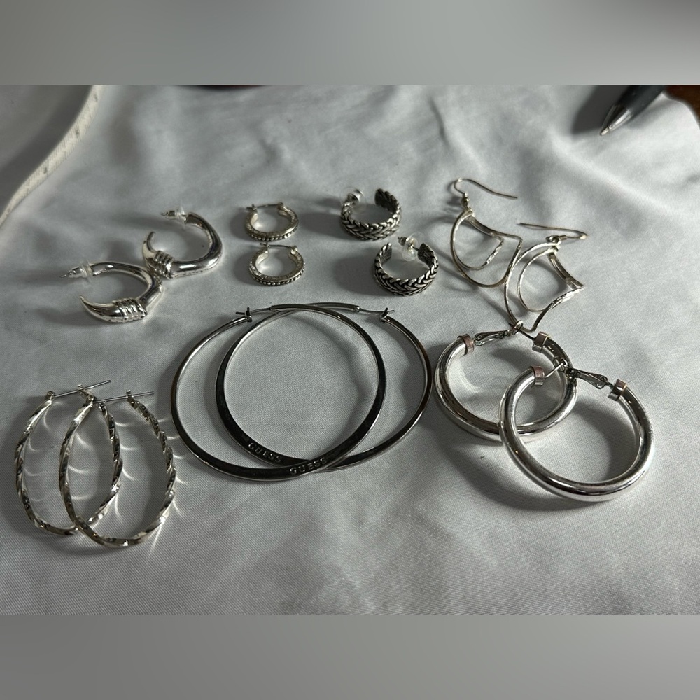 7 pair of various silvertone hoop earrings